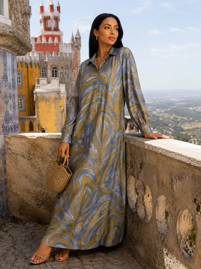 Robe chemise longue grande taille marron en viscose et coton avec col chemise, boutons et poches latérales.